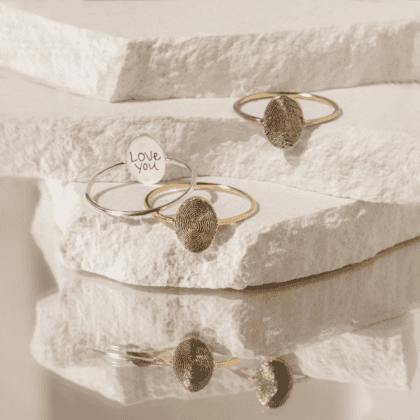 Handcrafted fingerprint jewelry rings with personalized design, featuring gold and silver options, perfect for custom jewelry lovers and memorable gifts.