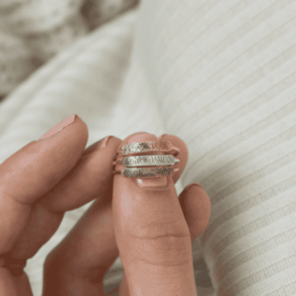Hammered silver stacking rings, handcrafted jewelry, minimalist design, unique textured finish, delicate band rings, customizable silver rings, elegant jewelry pieces for women, modern accessories, stylish finger rings.
