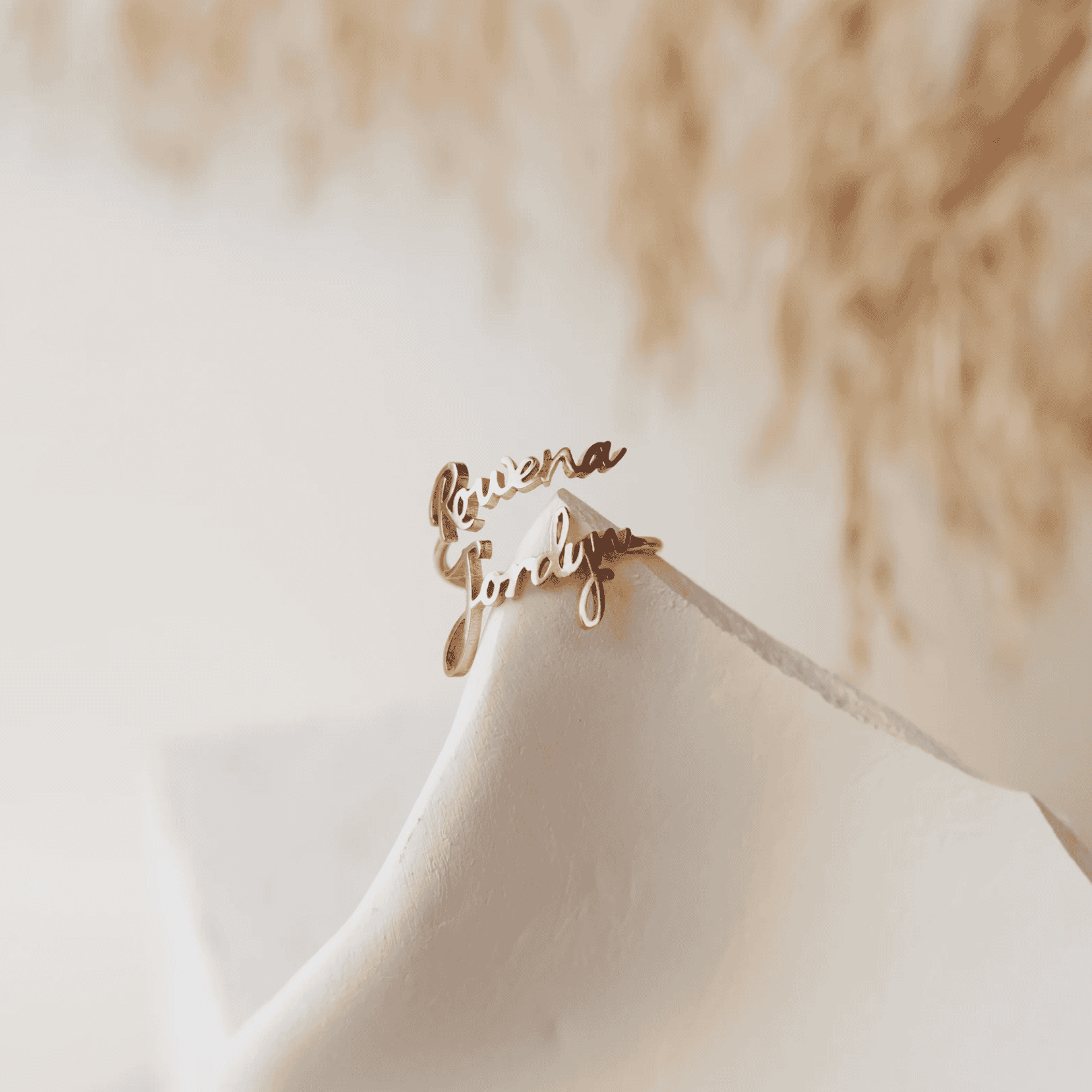 Personalized gold name necklace with custom jewelry design from Nayram.