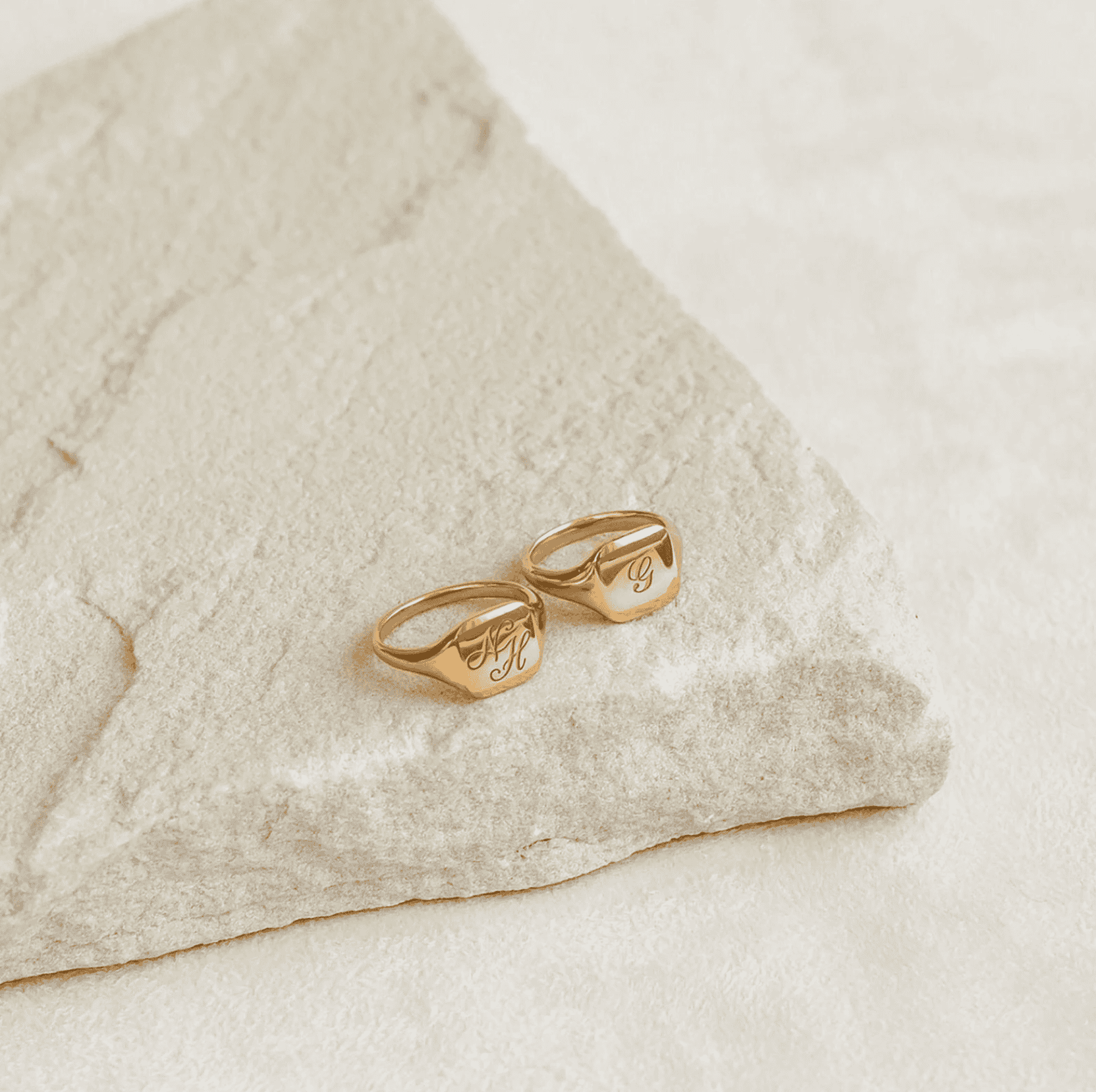 Elegant gold engraved personalized rings with initial monograms, perfect as custom jewelry gifts for special occasions.