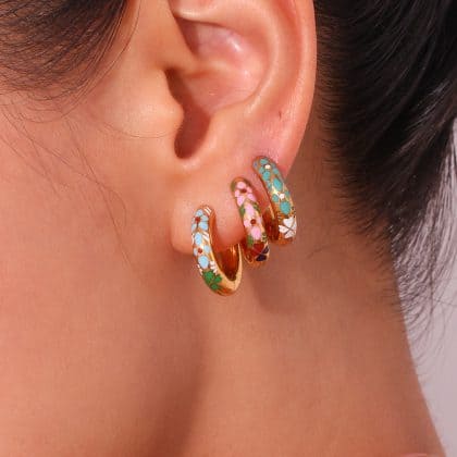 Colorful enamel floral hoop earrings with gold accents, perfect for custom jewelry designs. Unique, vibrant, and stylish jewelry pieces for modern fashion and personal expression.