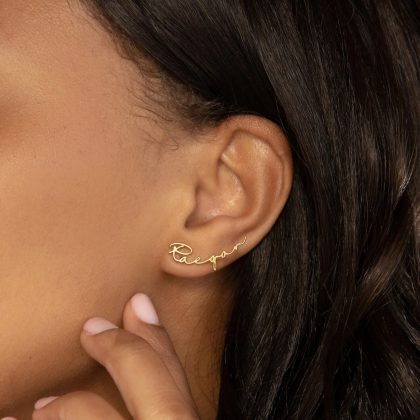 Personalized gold name earring featuring the word "Reagan" in elegant cursive script, perfect for custom jewelry lovers and unique jewelry gifts.