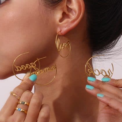 Gold custom jewelry earrings with "love" and "mama" script designs for personalized gift ideas. Perfect for women who appreciate unique, handmade jewelry and meaningful accessories.