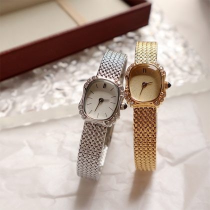 Luxury women’s jewelry watches with diamond accents and gold and silver braided bands, elegant and sophisticated for special occasions and fashion statements.