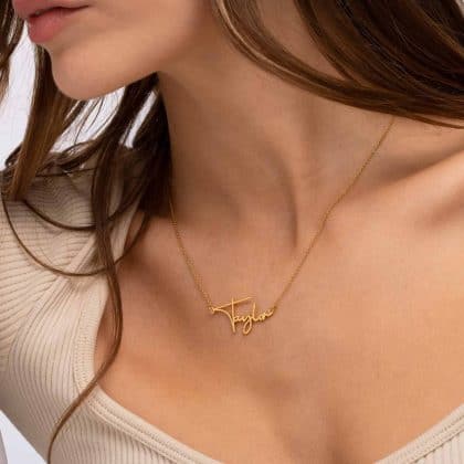 Personalized gold name necklace with custom script pendant for women and girls. Elegant jewelry perfect for everyday wear or special occasions. Unique custom jewelry designs from Nayram.